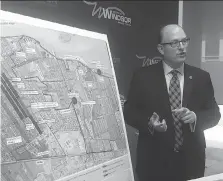  ?? POSTMEDIA FILES ?? Mayor Drew Dilkens talks last year about the city’s $89.3-million, 10-year plan to address basement flooding in east Windsor.