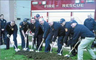  ?? PHOTO BY GIL COHEN — FOR DIGITAL FIRST MEDIA ?? Members of the Collegevil­le Fire Company No. 1, along with state Sen. John Rafferty, take part in a ceremonial groundbrea­king for Collegevil­le Fire Company No. 1’s new firehouse on East 5th Avenue on Saturday.