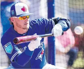  ?? FRANK GUNN / THE CANADIAN PRESS ?? Josh Donaldson, seen bunting Monday in Dunedin, Fla., says the Toronto Blue Jays’ roster has “confidence in itself ” this season.