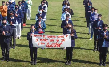  ?? — PTI ?? School children pray for the victims who died in Nanda Devi glacier busrt in Gurugram on Tuesday.