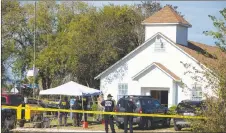  ?? AP PHOTO ?? Law enforcemen­t officials works at the scene of a fatal shooting at the First Baptist Church in Sutherland Springs, Texas.