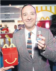  ?? ERIK VOAKE GETTY IMAGES FOR MCDONALD'S ?? Actor Tony Hale holds a Toy Story 4 Happy Meal toy after the movie’s premiere. McDonald’s is exploring ways to make its toys from a single type of plastic so they can more easily be recycled.