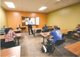  ?? STAFF PHOTO BY TIM BARBER ?? Dr. David Banks instructs a job preparatio­n class Thursday at the American Job Center Tennessee in Eastgate Town Center.