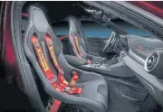  ??  ?? Race seats and six-point Sabelt harnesses for the track-spec Giulia GTAm.