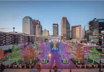  ?? ADAM CAIRNS/COLUMBUS DISPATCH ?? Civic leaders are seeking ideas for Downtown’s direction POST-COVID-19. The Columbus Commons Holiday Lights are shown here in a Nov. 22 photo.