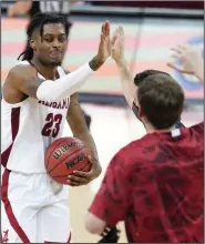  ?? (AP/Sean Rayford) ?? Alabama’s John Petty Jr. celebrates Tuesday after the No. 11 Crimson Tide’s 81-78 victory over South Carolina in Columbia, S.C. Petty had 20 points for Alabama, including 3 three-pointers.