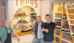  ?? KENN OLIVER/THE TELEGRAM ?? Boca Tapas Bar, an authentic Spanish tapas bar and restaurant in downtown St. John’s, opened for business Friday night. Co-owners (from right) Lorne Loder and Derek Locke say patrons can expect a menu of all the top offerings found in tapas bars...