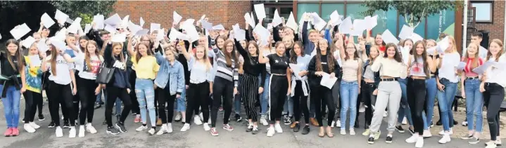  ??  ?? Fallibroom­e Academy students celebrate their GCSE results