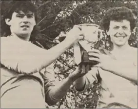  ??  ?? Injured skipper Tony Crosbie and captain for the day Eamon Murphy after the North End first team beat their seconds to clinch the Grattan Esmonde Cup in 1990.