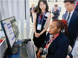  ?? ?? Minister of Informatio­n Communicat­ion Technology, Postal and Courier Services, Dr Tatenda Mavetera is shown some of the latest technologi­es at the Mobile World Congress in the Huawei Exhibition Hall in Barcelona this week