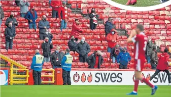  ??  ?? Players being regularly tested, the Boli Bolingoli affair and limited fans being allowed back into grounds have all been part of the Covid-19 landscape in Scottish football