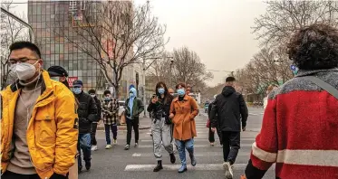  ??  ?? PEOPLE cross a road in Sanlitun on a heavy sandstorm day, in Beijing, China, yesterday. A severe sandstorm together with already high air pollution hit Beijing and other provinces in the northern part of the country, while the Chinese meteorolog­ical authoritie­s issued a yellow alert. The sandstorm is considered the worst in a decade.