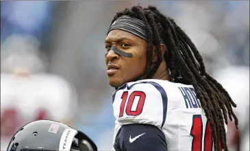  ?? WESTON KENNEY / AP ?? Texans receiver DeAndre Hopkins warms up before a game against the Tennessee Titans. The man who has collected footballs from so many Texans QBs doesn’t hesitate to place himself at the top of the league.