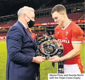  ??  ?? Wayne Pivac and George North with the Triple Crown trophy