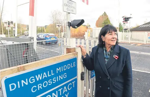  ?? Photograph by Sandy McCook. ?? CRUCIAL: Highland councillor Margaret Paterson at the Dingwall Central level crossing.