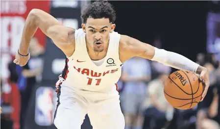  ?? MARK J. REBILAS/ USA TODAY SPORTS ?? Rookie guard Trae Young impressed the Hawks on Saturday against the Knicks in Las Vegas.