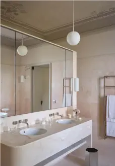  ??  ?? The master en suite is known as the Rose Bathroom, named after the Rosa Portogallo marble that envelopes the room. The dusty pink ceiling is an original fresco that the designers had restored