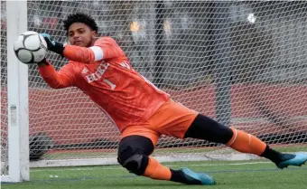  ??  ?? PITCHING A SHUTOUT: Burke goalie Lourenco Pereira makes a save against Manchester Essex on Sunday.