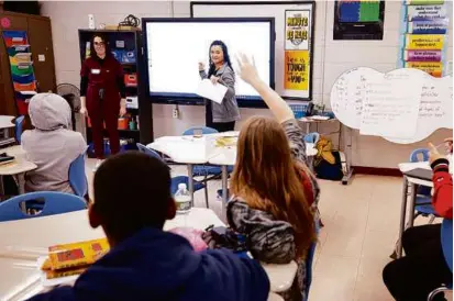  ?? NICK DENTAMARO/BROWN UNIVERSITY ?? Using the “Sex Ed by Brown Med” program, Brown University medical students Miranda Lassar and Natalie Kelley teach students at Calcutt Middle School in Central Falls, R.I.