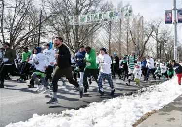  ?? TANIA BARRICKLO/DAILY FREEMAN ?? Runners head out from the starting line at the Shamrock Run in Kingston, N.Y., on Sunday, March 13, 2022.