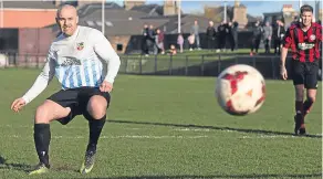  ??  ?? Allan Jarrett fires FC Boukir 1-0 ahead from the penalty spot in the Trident Trophies Second Division Cup Final against Bank Street Athletic.