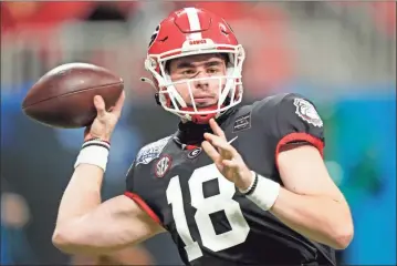  ?? AP - Brynn Anderson ?? After a strong showing in first season at Georgia, third-year sophomore quarterbac­k JT Daniels said he will be returning to the team instead of testing the NFL draft waters.