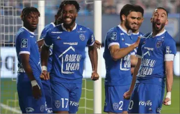  ?? AFP ?? Troyes’ teammates celebrate after Troyes’ forward Dylan Saint-Louis (second left) scored a goal during the French Ligue 2 football match against Dunkerque on May 8.