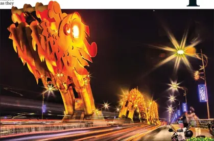  ??  ?? NEW FORCE: Vietnam, whose striking dragon bridge in Da Nang is now a tourist attraction, has been driving ahead