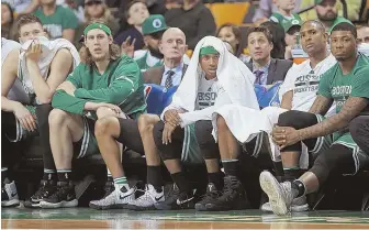  ?? STAFF PHOTO BY MATT STONE ?? DOWNER: The Celtics watch from the bench as the clock runs out on their big loss to the Cavs last night at the Garden.