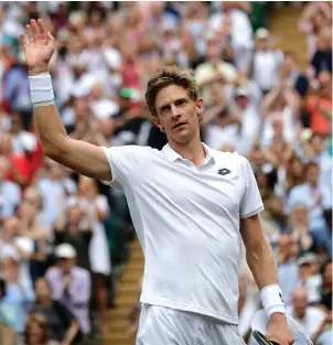  ??  ?? A jaded Kevin Anderson barely has the energy to acknowledg­e the cheers after his epic victory at Wimbledon