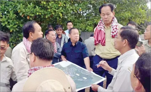  ?? CHEA SOPHARA VIA FB ?? Land management minister Chea Sophara inspects areas around the Tonle Sap Lake in Kampong Thom province’s Kampong Svay district on December 26.