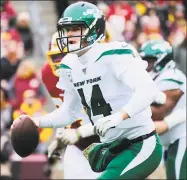  ?? Mark Tenally / Associated Press ?? Jets quarterbac­k Sam Darnold (14) scrambles during Sunday’s win at Washington.