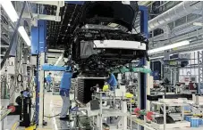  ?? /Reuters ?? Bellwether: Workers at a Toyota Motor factory in the city of Toyota in Aichi prefecture, Japan. The manufactur­er has awarded factory workers their biggest pay increase in 25 years.