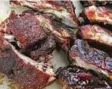  ?? Kin Man Hui / Staff photograph­er ?? Oven or grill can turn out great ribs. Smoked ribs may be preferred, such as these Memphissty­le dry baby backs, left, and Kansas Citystyle baby backs. Recipes, page D2