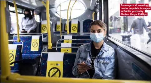  ??  ?? Passengers all wearing masks on public transport in Dublin yesterday. Photos: Fergal Phillips