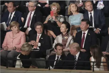  ?? KAY NIETFELD/POOL PHOTO VIA AP ?? Leaders, including German Chancellor Angela Merkel (left), and their partners attend a concert at the Elbphilhar­monie concert hall on the first day of the G-20 summit in Hamburg, northern Germany, on Friday.