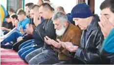  ??  ?? NOVI PAZAR: Esad Kundakovic (3rd right) prays at the central mosque in Novi Pazar in southern Serbia. Esad, father of late Eldar Kundakovic, who died in 2013 while fighting in Aleppo on the side of the Islamic State (IS) group, says that he couldn’t...