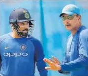  ?? AP ?? Rohit Sharma (L) listens to India head coach Ravi Shastri during a training session in Galle on Tuesday.