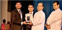  ??  ?? Arogya Farm Managing Director Azahim Ali (Extreme left) receiving the award from MP Mahinda Amaraweera