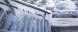  ?? (AP/Jens B’ttner) ?? A thick layer of ice and icicles has formed over a jetty staircase at temperatur­es of around -5 degrees at the pier in Gohren, Germany. Strong wind is causing snowdrifts and ice to form on the coastal region.