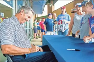  ?? Steven Eckhoff ?? Former Atlanta Brave Sid Bream (left) signs autographs for fans during his special appearance at Rome’s game on Thursday at AdventHeal­th Stadium.