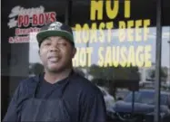  ?? PHOTOS BY THE ASSOCIATED PRESS ?? Rene “Sleepy” Washington stands outside his po boy sandwich shop in Houston on Aug. 28.