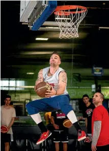  ?? PHOTO: JOSEPH JOHNSON/FAIRFAX NZ ?? Canterbury Rams guard Jeremy Kendle in mid flight during the team’s training session in Christchur­ch on Thursday.