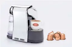  ??  ?? Coffee capsules and machine