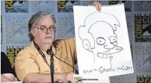  ?? MIKE COPPOLA GETTY IMAGES ?? Writer/producer Matt Groening shows a sketch of Apu at Comic-Con Internatio­nal 2017 in San Diego.
