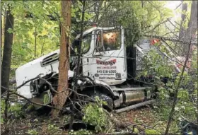  ?? PROVIDED ?? The flatbed truck is shown in the woods in the Saugerties hamlet of Centervill­e, N.Y., after Wednesday’s crash.