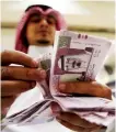  ?? AFP ?? Saudis who prefer cash for payments dropped to 20% in 2020.