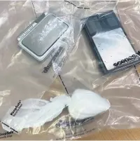  ??  ?? ● Weighing scales and cocaine (left), and cannabis (right) seized during the operation