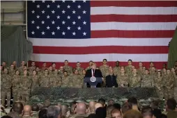  ?? Associated Press ?? ■ President Donald Trump addresses members of the military Thursday during a surprise Thanksgivi­ng Day visit at Bagram Air Field, Afghanista­n.