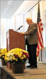  ?? LAUREN HALLIGAN - LHALLIGAN@DIGITALFIR­STMEDIA.COM ?? Honoree Edward A. Lenz speaks at the Saratoga Springs Rotary Education Foundation’s 18th annual Community Service Awards Brunch on Sunday at the Saratoga Springs City Center.